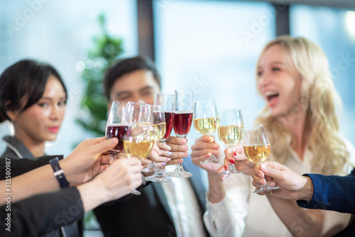 Business partners toast cha...