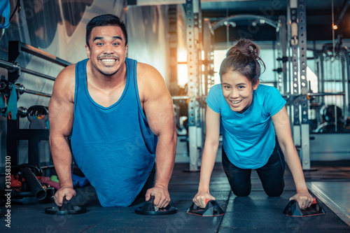 Teen couples exercise in the gym