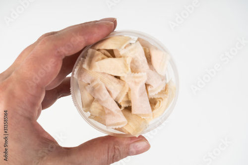the hand holds a Swedish snus nicotine