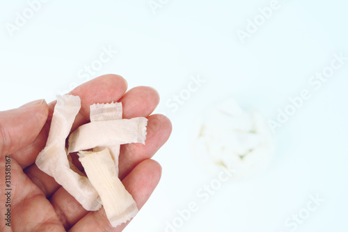 the hand holds a Swedish snus nicotine