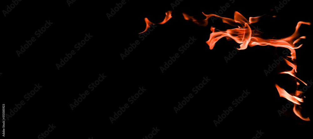 Flames of fire on a black background. The mystery of fire. Flames of fire on a black background. The mystery of fire.