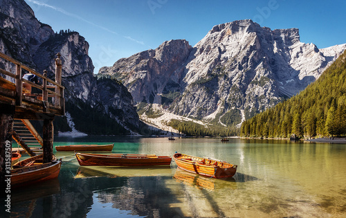 Sunny morning at Famouse Mountain Lake in dolomites Alps. Wonderful Braies Lake during sunrise. Amazing Summer Mountain Landscape. Lago di Braies in Spring, Awesome nature Scenery. Pragser wildsee