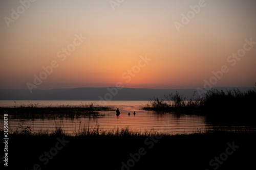 sunset over the lake in the kinneret of israel
