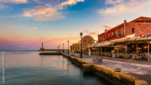 Venetian Harbour of the city of Chania at sunrise with turquoise water, Crete, Greece. View of the old port of Chania on Crete, Greece. Chania, Crete, Greece. View of the old port of Chania on Crete.