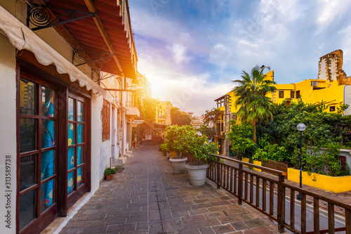 Fototapeta Naklejka Na Ścianę i Meble -  Street in the old town of Chania, Crete, Greece. Charming streets of Greek islands, Crete. Beautiful street in Chania, Crete island, Greece. Summer landscape. Chania old street of Crete island Greece.