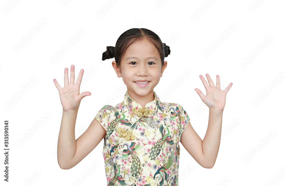 Portrait of Asian little girl wearing cheongsam with smiling and shows two palms, give five isolated over white background. Portrait of Asian little girl wearing cheongsam with smiling and shows two palms, give five isolated over white background.