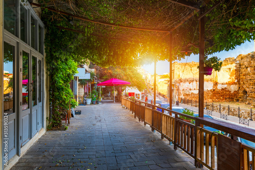 Fototapeta Naklejka Na Ścianę i Meble -  Street in the old town of Chania, Crete, Greece. Charming streets of Greek islands, Crete. Beautiful street in Chania, Crete island, Greece. Summer landscape. Chania old street of Crete island Greece.