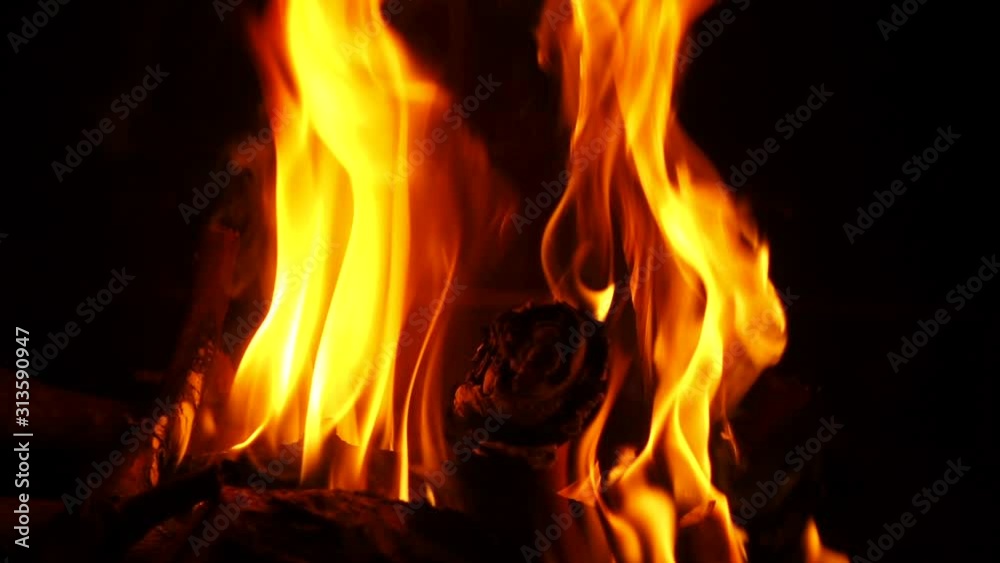 Slow motion video of cosy fireplace with reddish flame burning during winter holidays Slow motion video of cosy fireplace with reddish flame burning during winter holidays