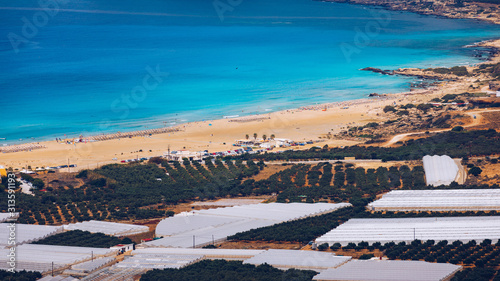 Fototapeta Naklejka Na Ścianę i Meble -  Shot of beautiful turquoise beach Falasarna (Falassarna) in Crete, Greece. View of famous paradise sandy deep turquoise beach of Falasarna (Phalasarna) in North West, Crete island, Greece.