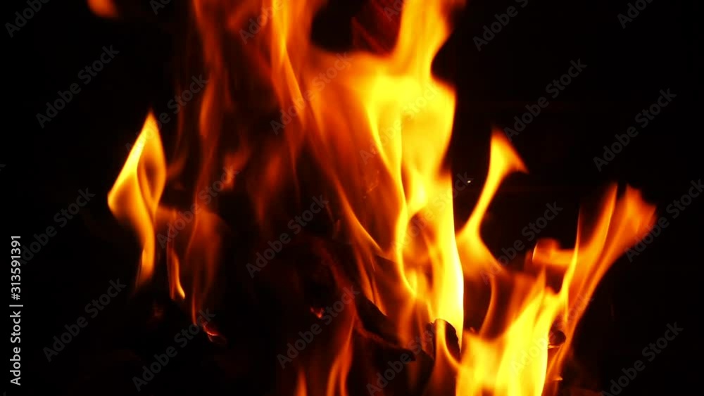 Slow motion video of cosy fireplace with reddish flame burning during winter holidays Slow motion video of cosy fireplace with reddish flame burning during winter holidays