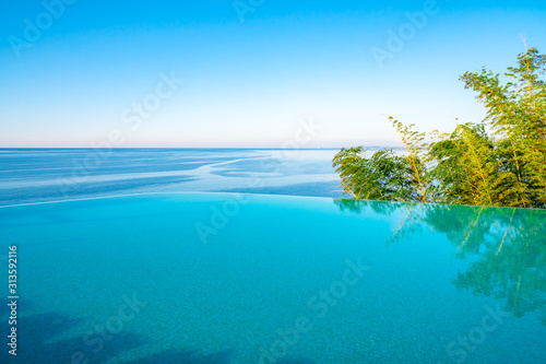 Fototapeta Naklejka Na Ścianę i Meble -  Infinity Edge Swimming Pool Water, Beautiful Black Sea View.