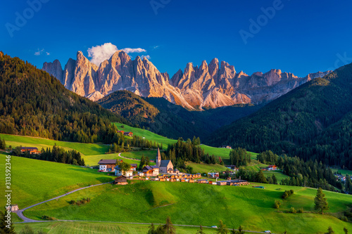 Santa Maddalena (Santa Magdalena) village with magical Dolomites mountains in background, Val di Funes valley, Trentino Alto Adige region, South Tyrol, Italy, Europe. Santa Maddalena Village, Italy. photo