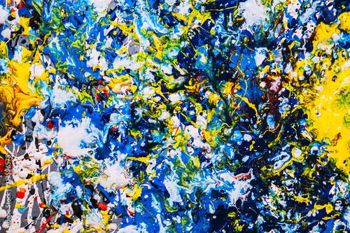 abstract expressonism. Picture painted using the technique of dripping. Mixing different colors red yellow blue white black. Horizontal orientation.