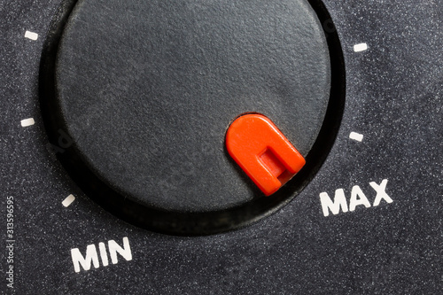 Obraz na płótnie Close up macro view of vintage tape machine volume dial set to MAX. 