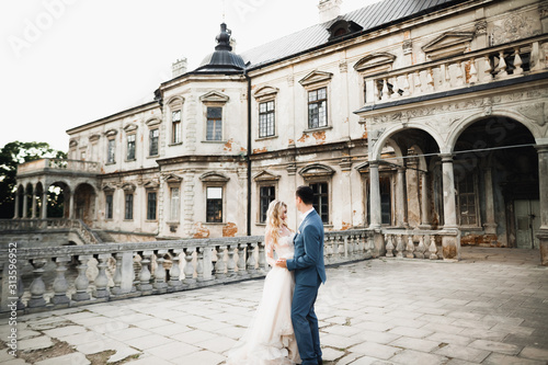 Romantic wedding moment, couple of newlyweds smiling portrait, bride and groom hugging
