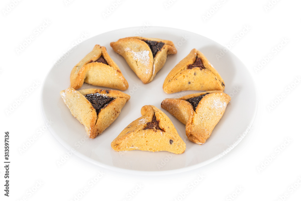 Haman's ears are also called Hamantaschen - a traditional Jewish pastry for Purim holiday. Organized in interesting shapes and isolated on a white background.