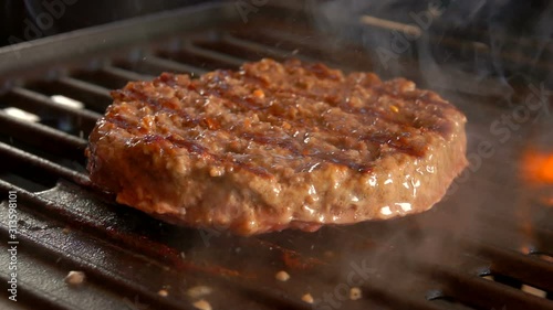 Cesam bun falls on the table. Prepared products for hamburgers on the table  photo