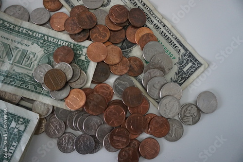 A macro shot of US currency featuring dollars, cents.