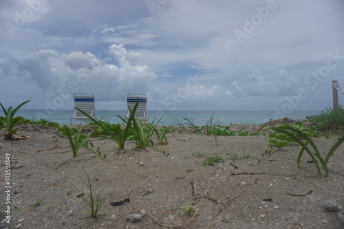 Some chairs on the sand in miami beach, florida