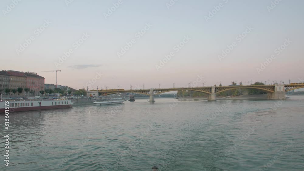 Margaret bridge in Budapest Hungary Danube river old architecture dusk evening cityscape departure panorama from boat Margaret bridge in Budapest Hungary Danube river old architecture dusk evening cityscape departure panorama from boat