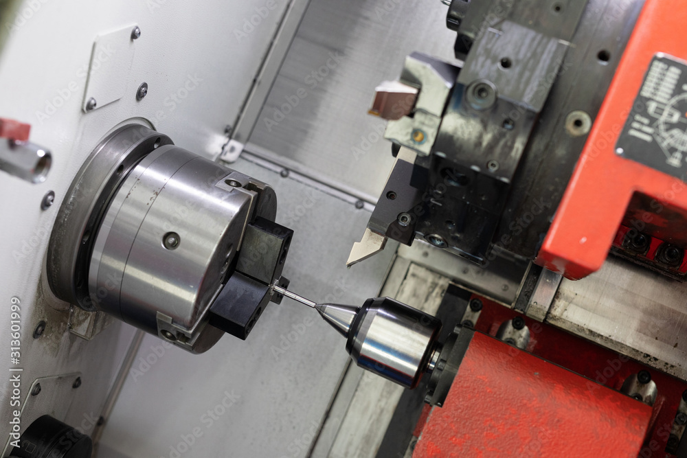 Fototapeta premium portrait of the working machine in the plant of the metal details
