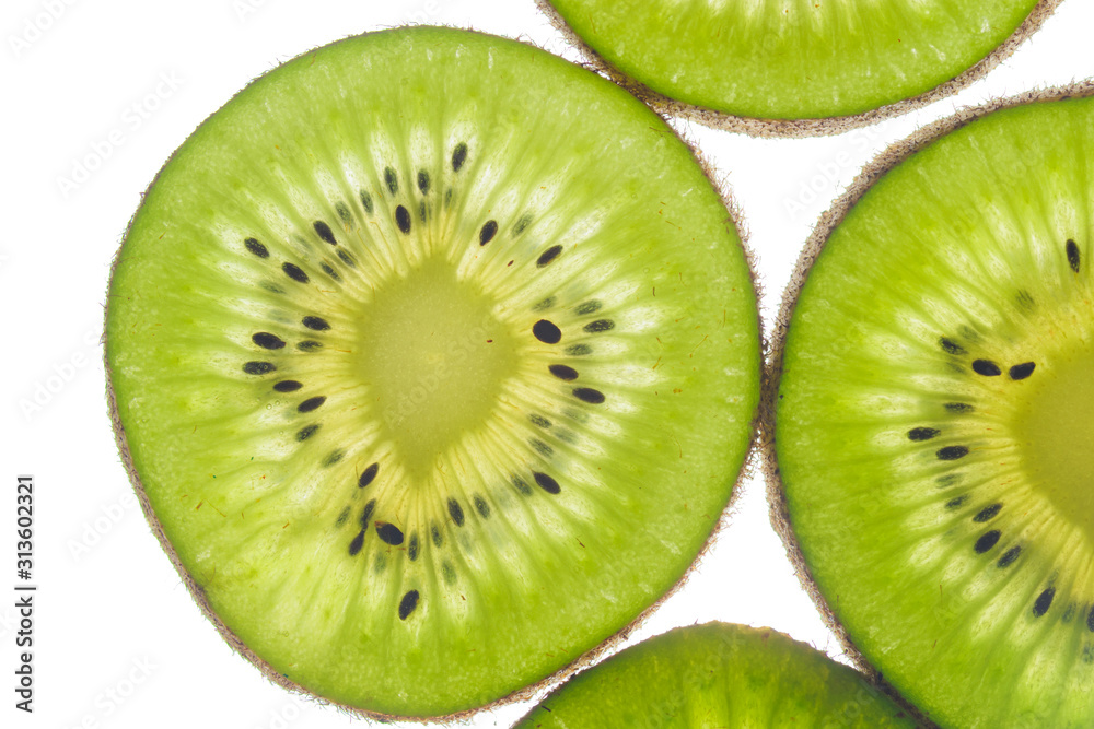 round kiwi slices on a white background. Isolated on white. close up round kiwi slices on a white background. Isolated on white. close up