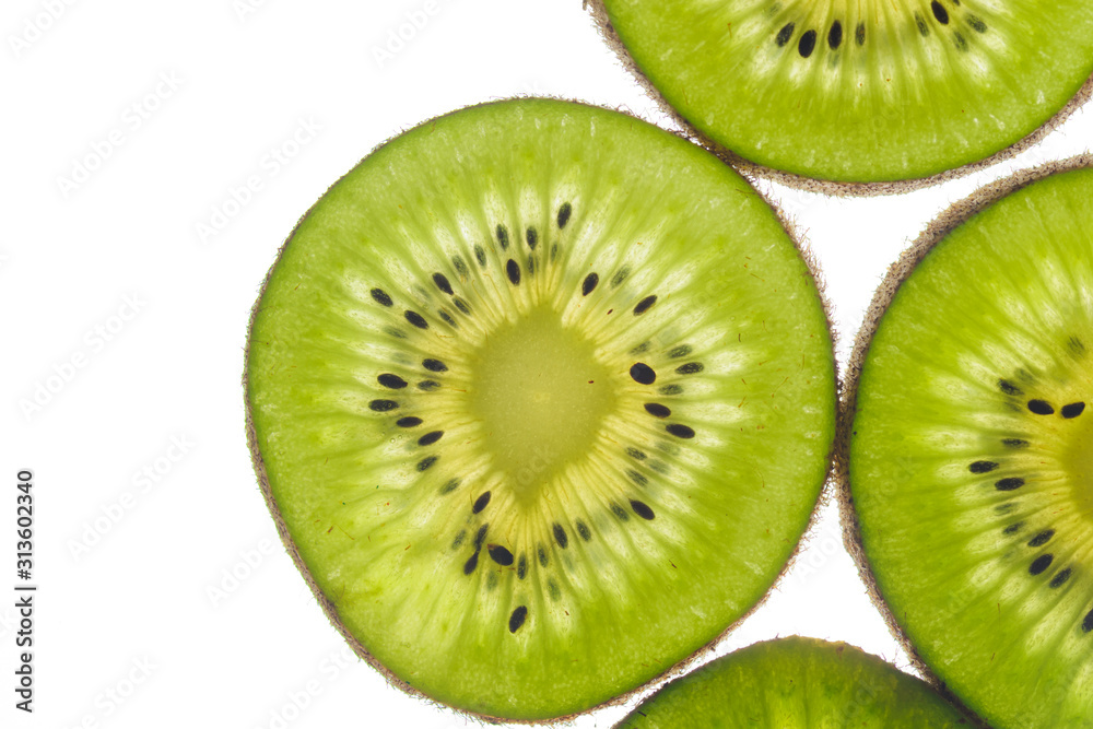 round kiwi slices on a white background. Isolated on white. close up round kiwi slices on a white background. Isolated on white. close up