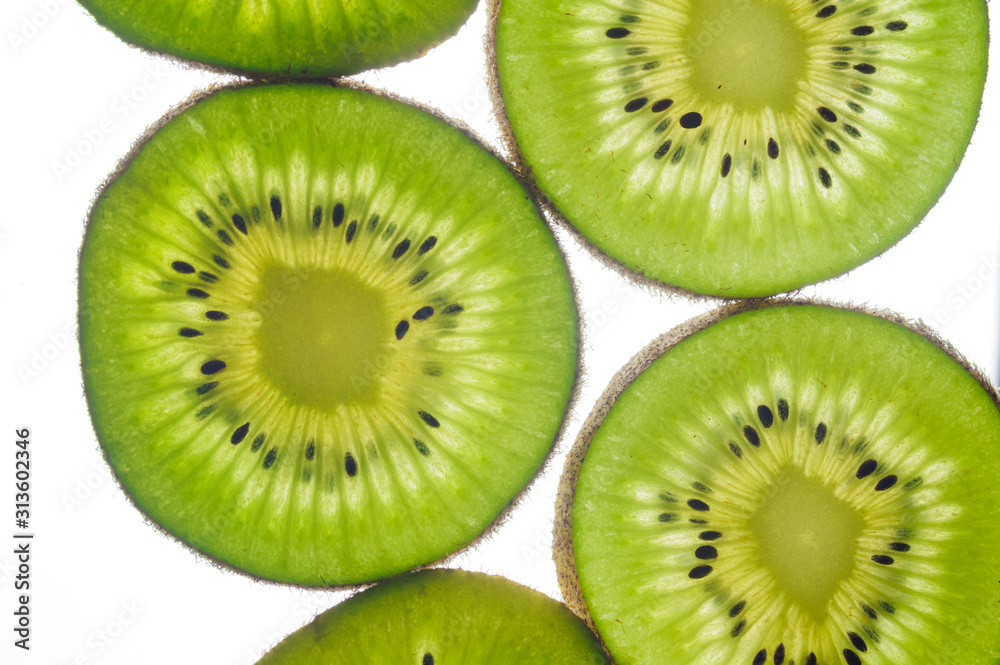 round kiwi slices on a white background. Isolated on white. close up round kiwi slices on a white background. Isolated on white. close up