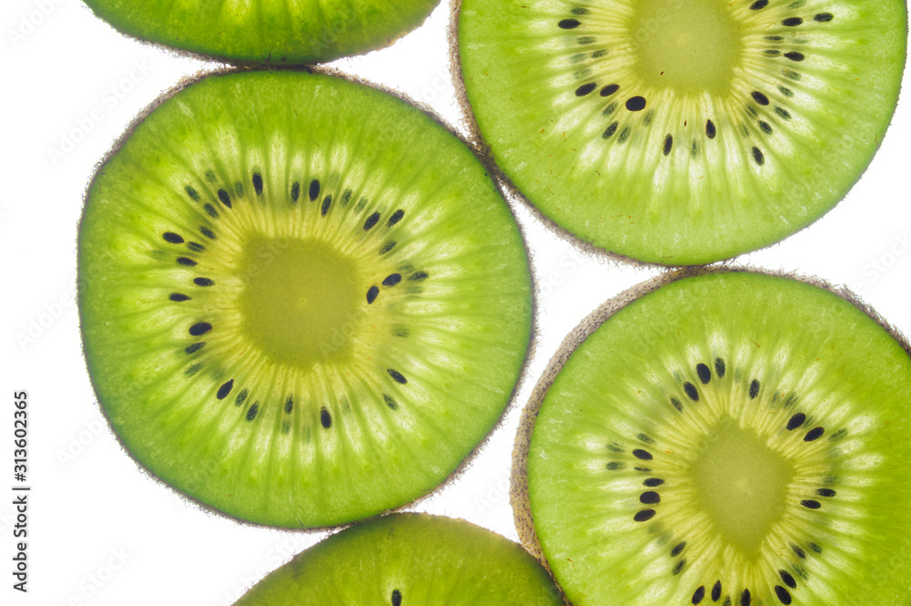 round kiwi slices on a white background. Isolated on white close up round kiwi slices on a white background. Isolated on white close up