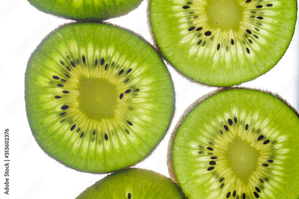round kiwi slices on a white background. Isolated on white close up round kiwi slices on a white background. Isolated on white close up
