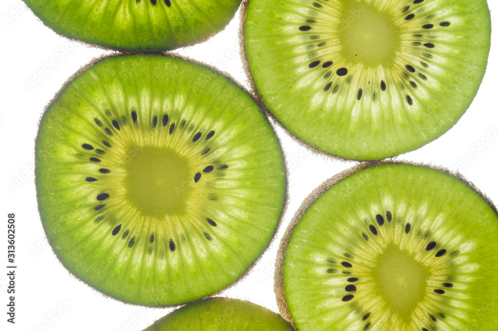 round kiwi slices on a white background. Isolated on white. close up round kiwi slices on a white background. Isolated on white. close up