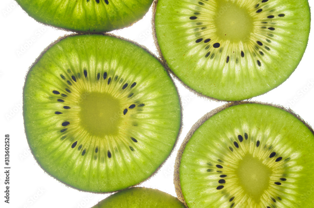 round kiwi slices on a white background. Isolated on white. close up round kiwi slices on a white background. Isolated on white. close up