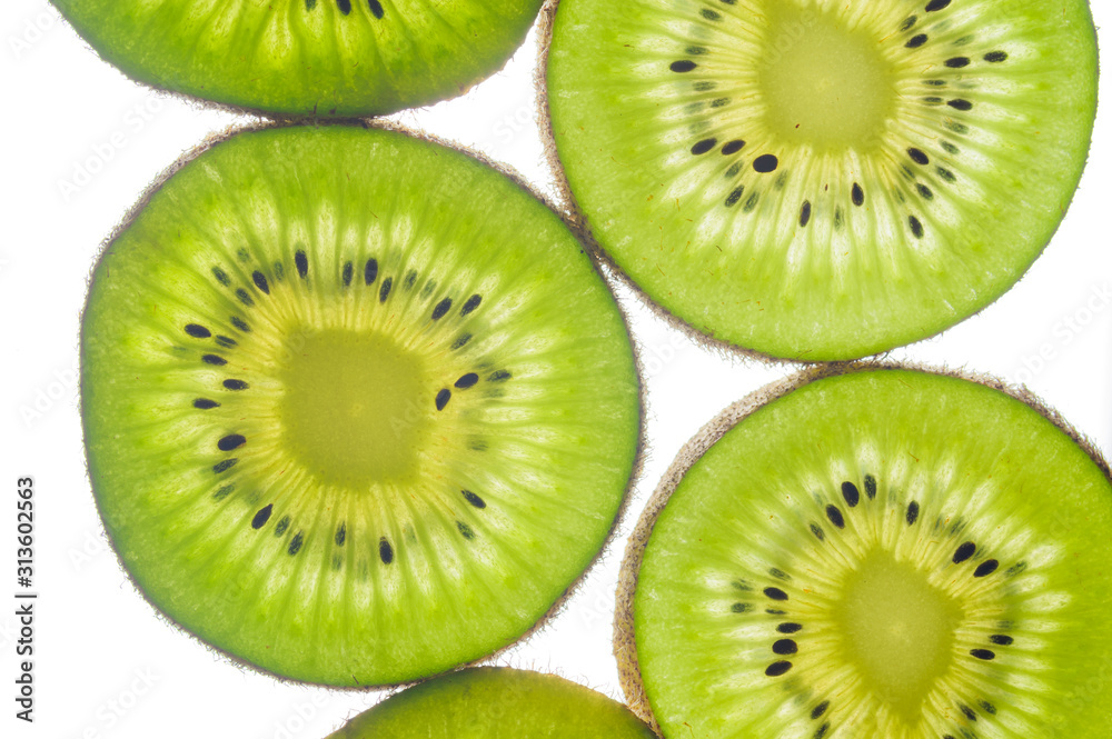 round kiwi slices on a white background. Isolated on white. close up round kiwi slices on a white background. Isolated on white. close up
