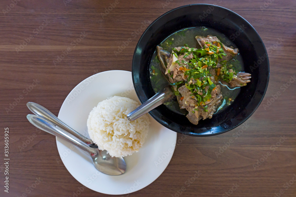 Top view composition of various Asian food on wooden table, Hot and Spicy Soup with Pork Ribs and Streamed rice. Top view composition of various Asian food on wooden table, Hot and Spicy Soup with Pork Ribs and Streamed rice.