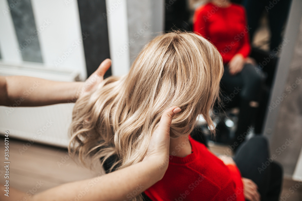 Beautiful hairstyle of woman after dyeing hair and making highlights in hair salon. Beautiful hairstyle of woman after dyeing hair and making highlights in hair salon.
