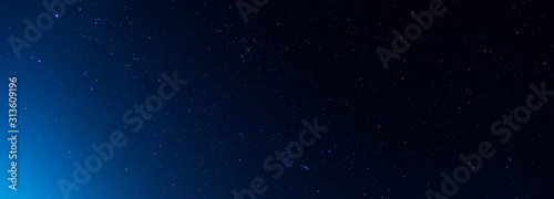 Panorama blue night sky milky way and star on dark background.Universe filled with stars  nebula and galaxy with noise and grain.Photo by long exposure and select white balance.selection focus.amazing