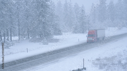 Truck hauls a container across the state of Washington and through a snowstorm.