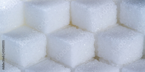 macro of a cube pattern made out of sugar cubes