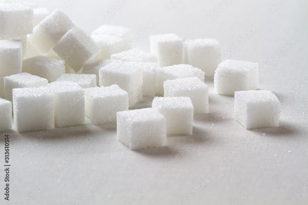 high key Closeup of a Pile of sugar cubes randomly arranged on a white background high key Closeup of a Pile of sugar cubes randomly arranged on a white background
