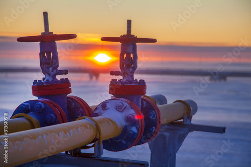 Oil, gas industry. Group wellheads and valve armature , Gas valve, Gas well of high pressure; gas production process photo