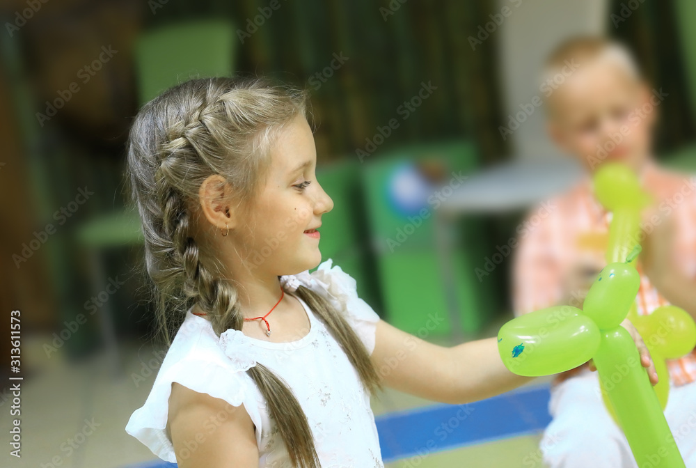 closeup.portrait of a little girl playing in kindergarten - obrazy, fototapety, plakaty 
