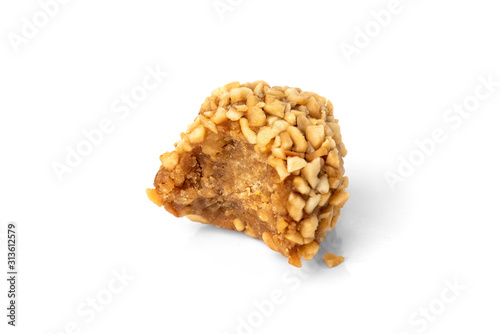 Cake "Potatoes" sprinkled nuts isolated on white background.