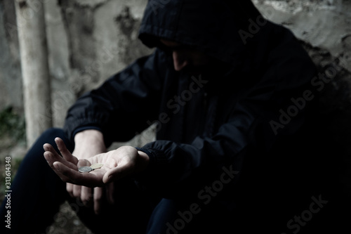 sad man empty hand on dark background