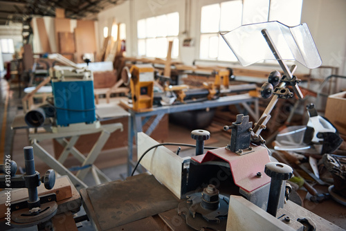 Machinery and tools inside of a large woodworking shop