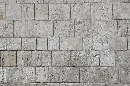 Grey modern coble stone background. Close up top view on monotone gray brick stone. Sidewalk or pavement. photo