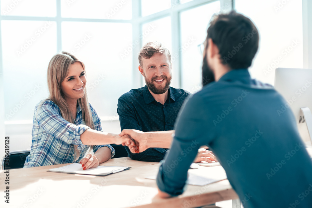 managers interview the applicant sitting at the office table. managers interview the applicant sitting at the office table.
