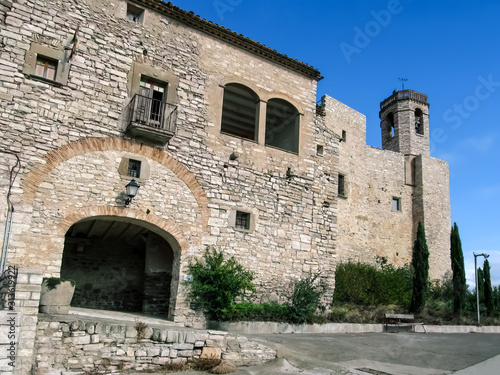 Spain, Montfalco Murallat - October 10, 2018: Arched entrance to Montfalco Murallat mediaeval village-fortress (Lleida), outside view. Tourist place in Catalonia with ancient stone walls and a chapel