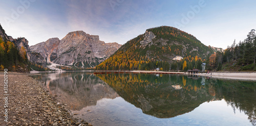 Panorama of Lago di Braies lake and Seekofel peak at dawn  Dolomites. Italy