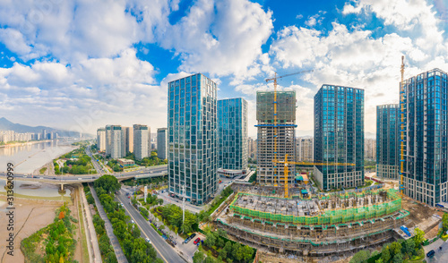 Urban scenery on both sides of minjiang river, fuzhou city, fujian province, China photo