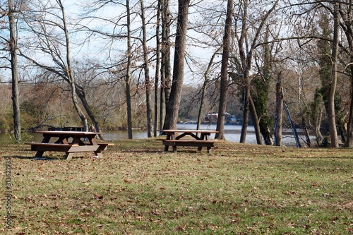 The empty picnic tables in the country park.